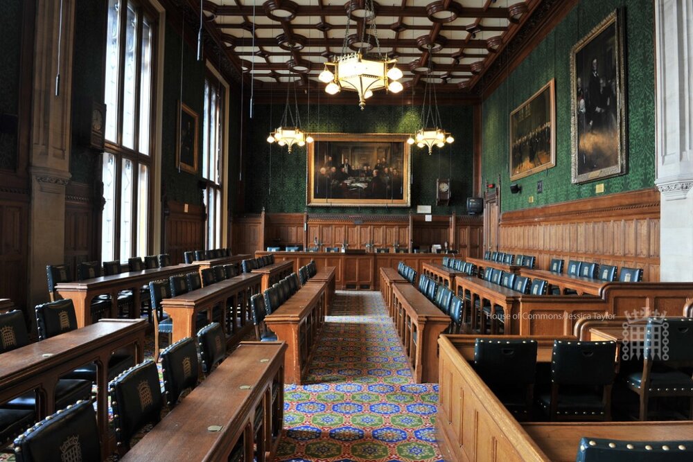 Interior view of a hall with paintings on the wall