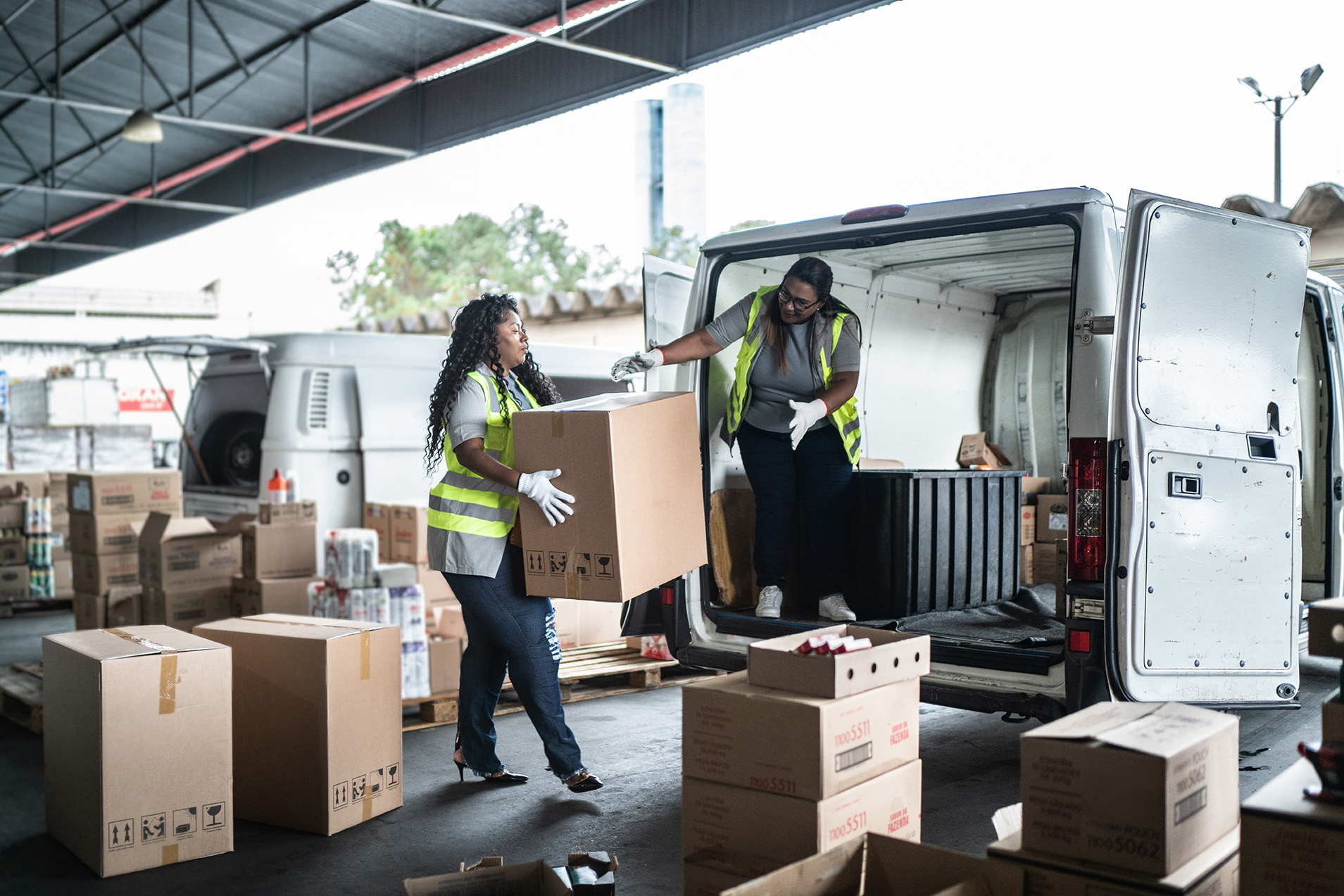 Women loading package to a van
